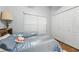 Comfortable bedroom with a plush bed, blinds and a closet with double doors at 1752 Challenger Ave, Davenport, FL 33897