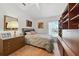 Relaxing bedroom with carpet, built-in shelving, and a comfy bed with ambient lighting at 1752 Challenger Ave, Davenport, FL 33897