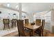 Cozy dining room featuring a wooden table, cushioned chairs, and ample natural light at 1752 Challenger Ave, Davenport, FL 33897