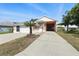 Charming single-story home with a well-maintained front yard and a spacious two-car garage at 1752 Challenger Ave, Davenport, FL 33897