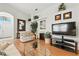 Bright living room with a large TV, comfortable seating, and a view of the entrance at 1752 Challenger Ave, Davenport, FL 33897