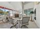 Bright and airy patio with a glass table, comfortable seating, and views of the outdoors at 1752 Challenger Ave, Davenport, FL 33897