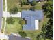 Aerial view of the home and surrounding area with some landscaping at 10675 Fairhaven Way, Orlando, FL 32825