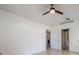 Bright bedroom featuring tile flooring and views into other rooms at 10675 Fairhaven Way, Orlando, FL 32825