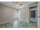 Bedroom featuring a window, a closet, a fan and painted subfloor at 10675 Fairhaven Way, Orlando, FL 32825