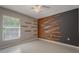 Bedroom featuring hardwood decor accent, neutral walls, and ceiling fan at 10675 Fairhaven Way, Orlando, FL 32825