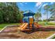 A colorful playground provides a fun and safe space for children, complete with slides, stairs, and interactive play features at 10675 Fairhaven Way, Orlando, FL 32825