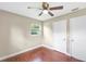 Cozy bedroom featuring two closets, natural light and wood-look floors, making it feel spacious and modern at 1204 Marie Ave, Apopka, FL 32703