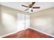 Bedroom featuring two closets, natural light and wood-look floors, a comfortable and practical space at 1204 Marie Ave, Apopka, FL 32703