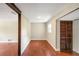 Bedroom featuring wood-look floors, bright window, and closet storage space at 1204 Marie Ave, Apopka, FL 32703