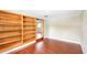 Spacious bedroom offering wood-look flooring and ample storage with built-ins at 1204 Marie Ave, Apopka, FL 32703