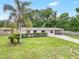 Exterior shot of home with lawn and carport at 1204 Marie Ave, Apopka, FL 32703