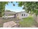 Back exterior view of home with carport and yard at 1204 Marie Ave, Apopka, FL 32703
