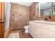 Bathroom with a tub and shower combination and patterned tile walls and floors at 123 Se 1St Ave, Webster, FL 33597