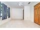 Bright bedroom with tile floors, a ceiling fan, and a closet, offering a versatile space at 123 Se 1St Ave, Webster, FL 33597