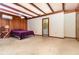 Large primary bedroom featuring wood accents, ceiling fan, and adjoining bath at 123 Se 1St Ave, Webster, FL 33597