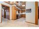 View of kitchen featuring wooden cabinets, tile floors, and updated dishwasher at 123 Se 1St Ave, Webster, FL 33597