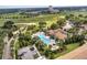 Aerial view of the community pool and golf course at 1246 Payne Stewart Dr, Davenport, FL 33896