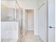 Modern bathroom featuring a glass shower and linen closet with shelving at 1246 Payne Stewart Dr, Davenport, FL 33896
