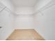 Walk-in closet with white walls and wire shelving for ample storage at 1246 Payne Stewart Dr, Davenport, FL 33896