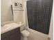Well-lit bathroom featuring a shower-tub combo and stylish vanity at 129 Boydfield Ln, Davenport, FL 33837
