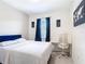 Bright bedroom featuring decor, a desk, and a large window providing ample natural light at 129 Boydfield Ln, Davenport, FL 33837