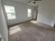 Spacious bedroom with carpet, great natural light from dual windows and neutral paint at 129 Boydfield Ln, Davenport, FL 33837