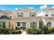 Charming two-story home featuring a cozy front porch, well-maintained landscaping, and inviting curb appeal at 129 Boydfield Ln, Davenport, FL 33837