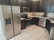 Well-equipped kitchen featuring stainless steel appliances and ample counter space at 129 Boydfield Ln, Davenport, FL 33837