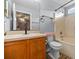 Bathroom with a single vanity, white toilet, and a shower with a tub at 135 Inconnu Ct, Kissimmee, FL 34759