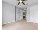 Neutral bedroom with a ceiling fan, closet and backyard views, perfect for a calm, comfortable, private retreat at 135 Inconnu Ct, Kissimmee, FL 34759