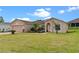 Beautiful one-story home with lush landscaping and two-car garage at 135 Inconnu Ct, Kissimmee, FL 34759