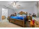 Large main bedroom with bathroom and ceiling fan at 135 Inconnu Ct, Kissimmee, FL 34759