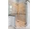 Modern bathroom featuring a glass-enclosed shower with tile surround and a stylish mosaic accent at 1415 Brumley Rd, Chuluota, FL 32766