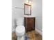Small bathroom featuring dark wood vanity and a mirror above the sink at 1415 Brumley Rd, Chuluota, FL 32766