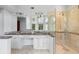 Bathroom with double sinks, granite counters, glass shower and views from many windows at 1415 Brumley Rd, Chuluota, FL 32766