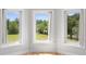 Bedroom with hardwood floors and a bay window offering outdoor views at 1415 Brumley Rd, Chuluota, FL 32766