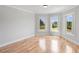 Spacious bedroom with hardwood floors and a bay window offering outdoor views at 1415 Brumley Rd, Chuluota, FL 32766