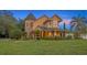 Charming two-story home featuring a turret and well-maintained landscaping at 1415 Brumley Rd, Chuluota, FL 32766