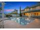 Backyard with a sparkling pool and spa featuring a charming home exterior at 1415 Brumley Rd, Chuluota, FL 32766