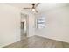 A simply styled bedroom offers a ceiling fan and natural light at 1422 Russell Ave, Orlando, FL 32806