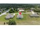 Aerial view of the home in its neighborhood setting, showcasing the backyard and surrounding properties at 14322 Sw 28Th Ave, Ocala, FL 34473