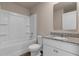 Bathroom featuring a shower-tub combo with granite counters and ample lighting at 14322 Sw 28Th Ave, Ocala, FL 34473