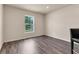 Cozy bedroom with wood floors, a window for natural light, and neutral paint, creating a tranquil atmosphere at 14322 Sw 28Th Ave, Ocala, FL 34473