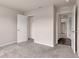 Spacious bedroom with carpeting, closet, and doorway to bathroom at 14322 Sw 28Th Ave, Ocala, FL 34473