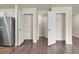 Spacious closets with open doors, wire shelving, and stainless steel fridge for optimal organization and storage solutions at 14322 Sw 28Th Ave, Ocala, FL 34473