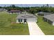 Charming single-story home featuring a two-car garage, well-manicured lawn, and a clean, modern facade at 14322 Sw 28Th Ave, Ocala, FL 34473