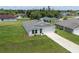 Angle aerial view of the home with a large lawn, and a two car garage at 14322 Sw 28Th Ave, Ocala, FL 34473