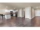 Living room area near kitchen with breakfast bar, stainless appliances, and modern lighting at 14322 Sw 28Th Ave, Ocala, FL 34473
