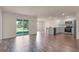 Open concept living room and kitchen with stainless appliances and access to the patio at 14322 Sw 28Th Ave, Ocala, FL 34473